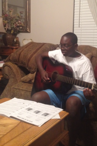 My son, practicing his guitar